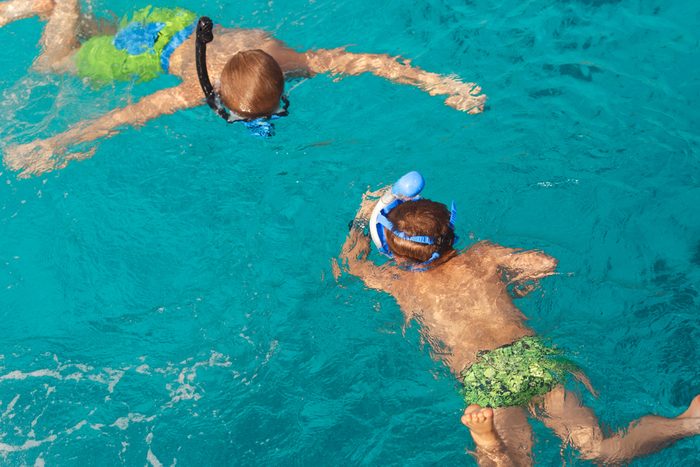 kids swimming with snorkeling gear