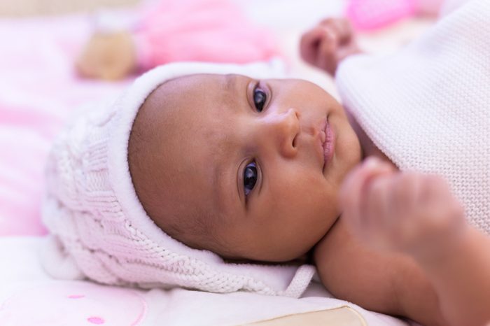 Adorable little african american baby girl looking 