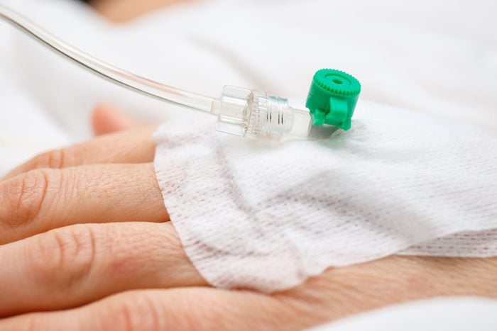 Close up of a iv drip in patient's hand