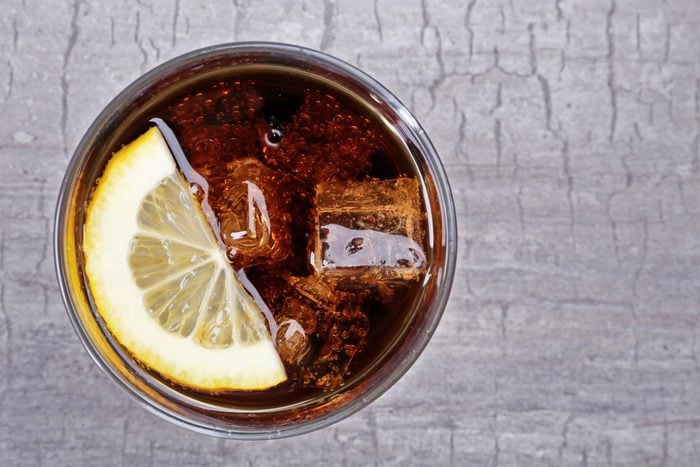 Glass of cola with ice and lemon