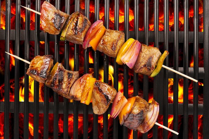 meat skewers on a grill