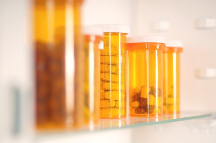 Bottles of pills in cabinet