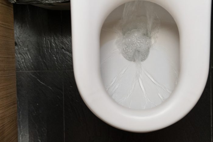 water in toilet bowl flushing