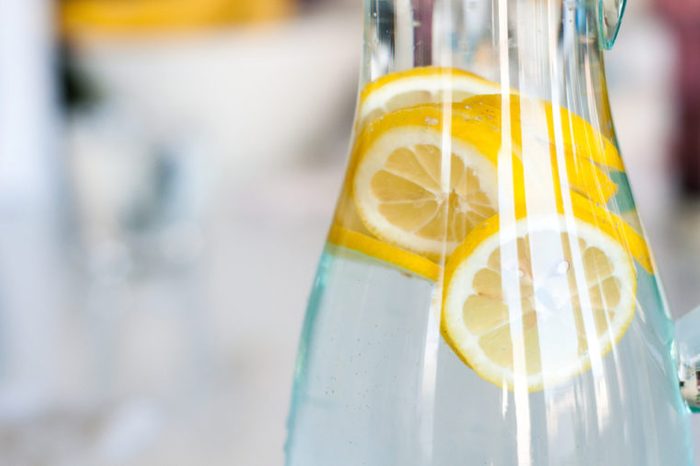 Yellow lemon slices in a clear bottle of water