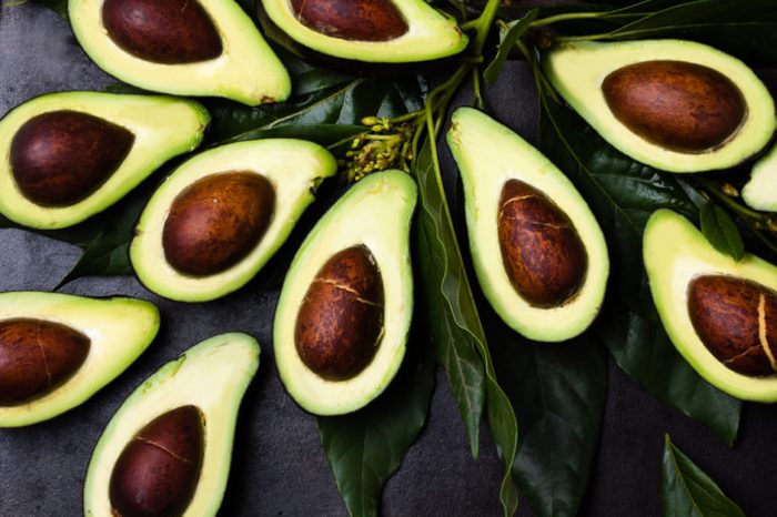 avocado halves with pits