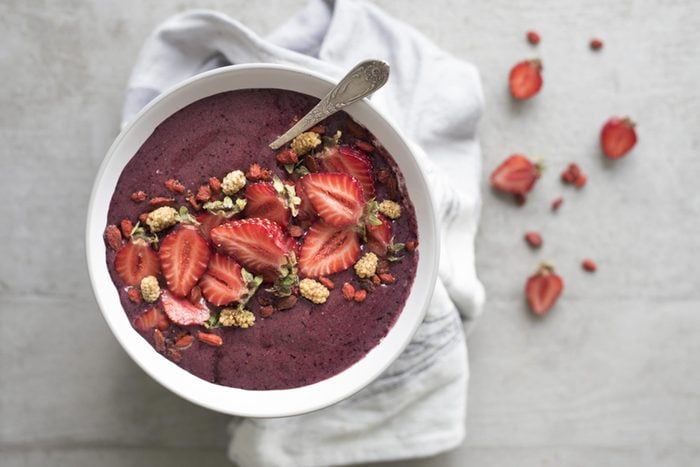 acai bowl with strawberries and grains