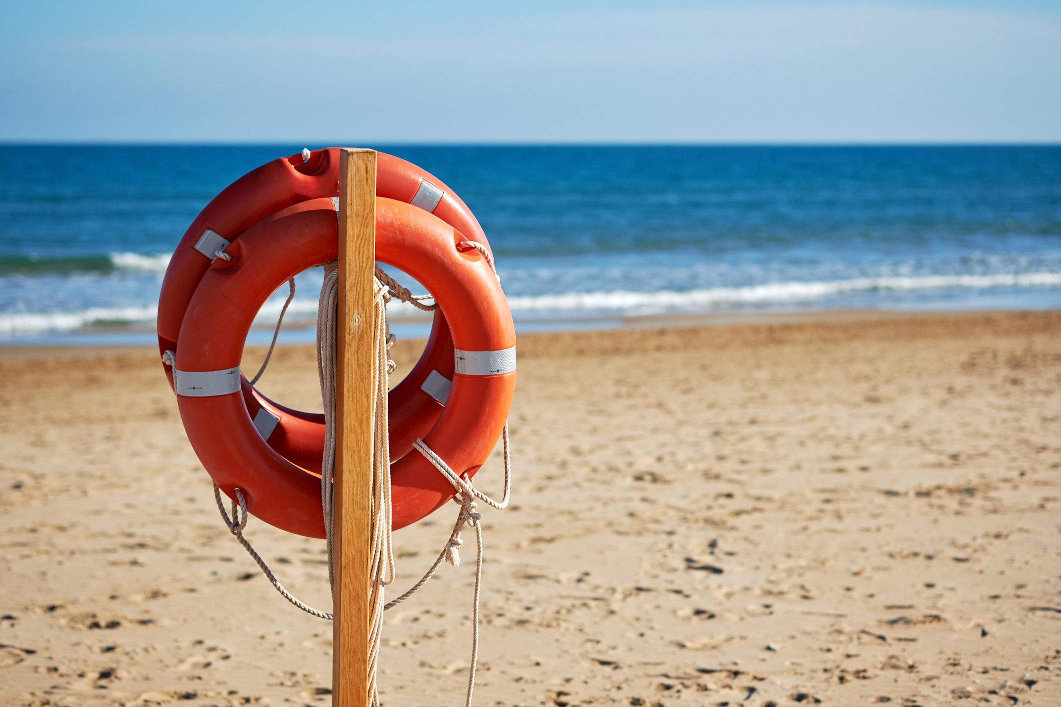 life buoys on the beach in the summer