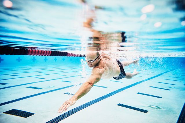man swimming for exercise