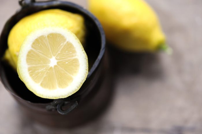 Jar of yellow lemons.