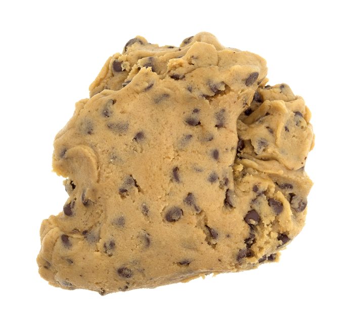 A ball of chocolate chip cookie dough isolated on a white background.