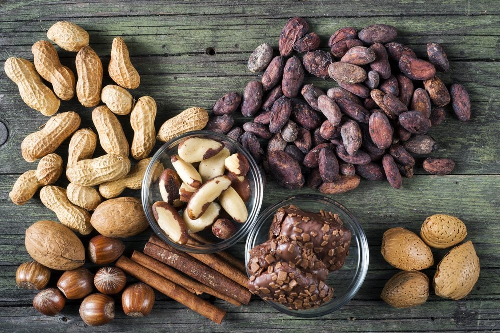 cocoa and nuts of various kinds on wooden table