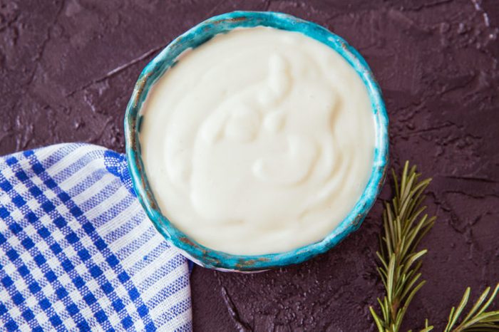 Delicious sour cream or mayonnaise. Vegetarian mayonnaise without eggs from mustard, milk, vegetable oil and lemon juice.