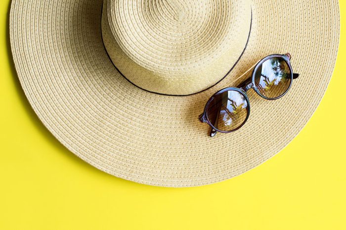 Straw Beach Woman's Hat Sun Glasses Top View Yellow Background Flat Single
