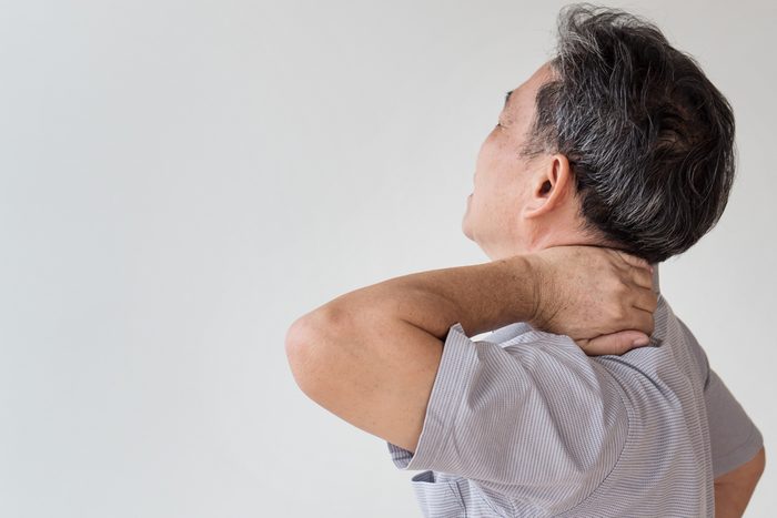 man suffering from neck, shoulder pain