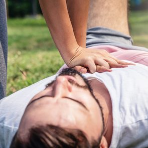 close up of woman giving man cpr