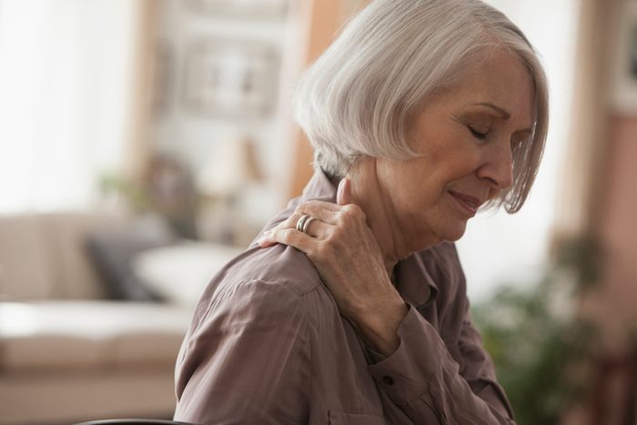 mature woman with shoulder pain