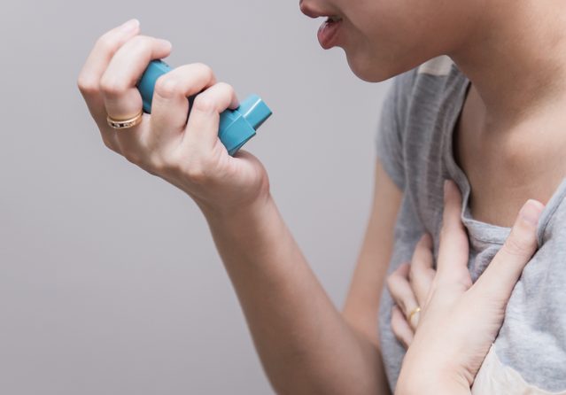 cropped shot of woman holding inhaler for COPD