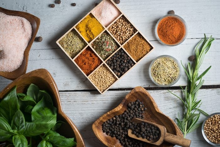 A variety of colorful spices and fresh herbs
