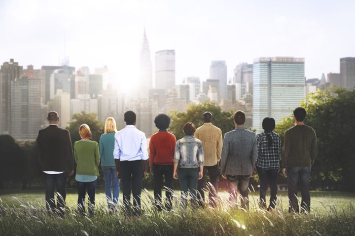group of diverse people overlooking city scape