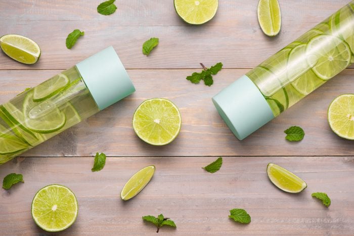 Water with Lime and Mint in Sports Bottle, with slices of lime.