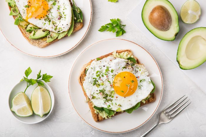 Toast with avocado, spinach and fried egg.