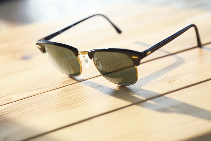 sunglasses on a wood table
