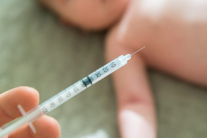 Close-up Of A Doctor Hand Vaccinating Baby
