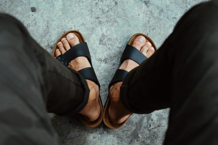 Male feet in sandals 