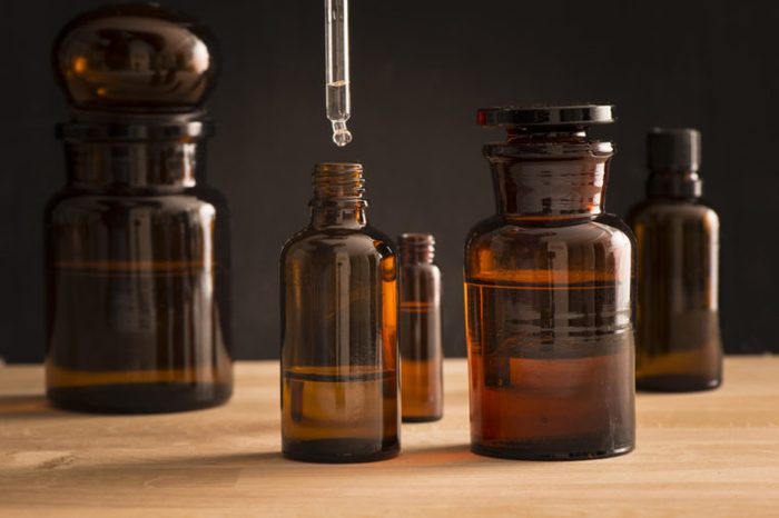 Old style medicine glass bottles with tea tree oil