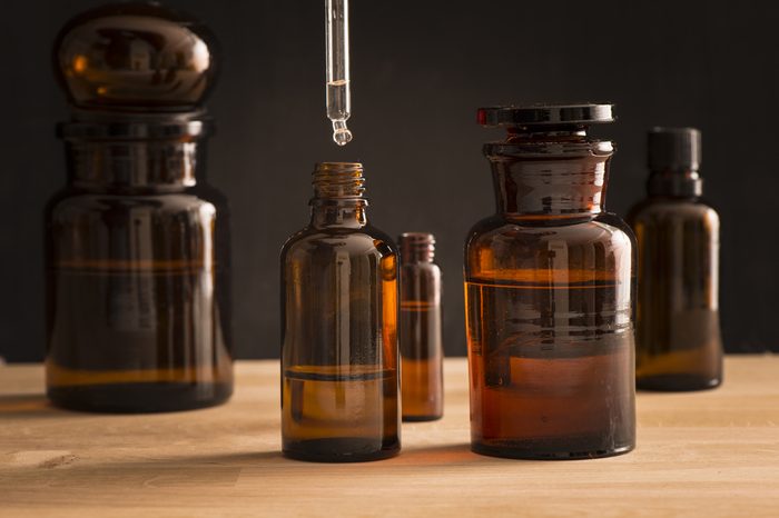 Old style medicine glass bottles with tea tree oil