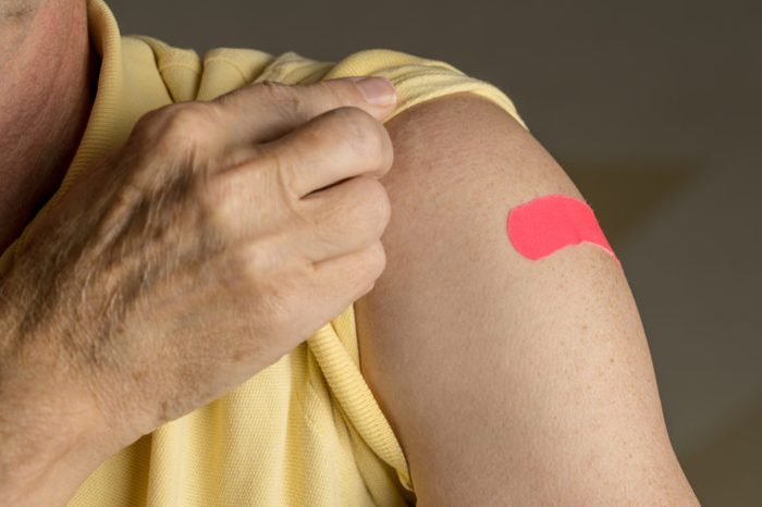 vaccine band aid on arm