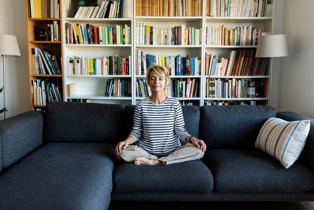 woman at home meditating