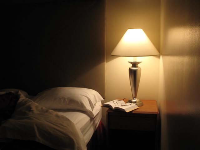 bedroom at night with lamp light on