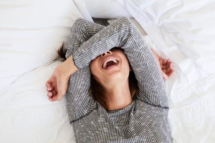 laughing woman girl in bed queef