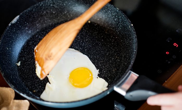 Closeup of cooked fried egg on the pan