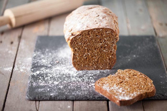Load of brown bread on a slate cutting board