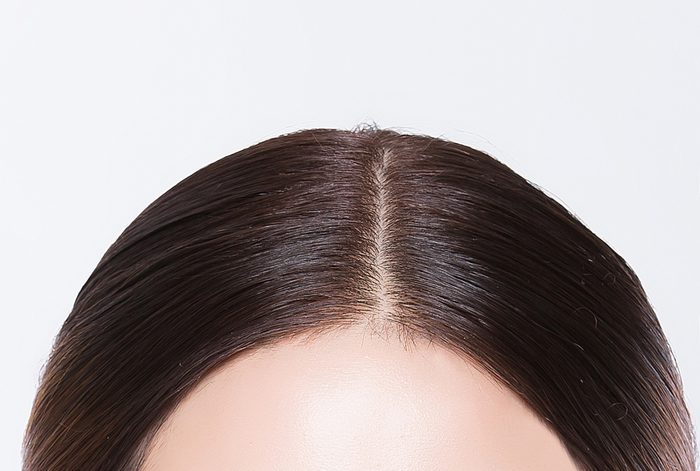 woman scalp hair part