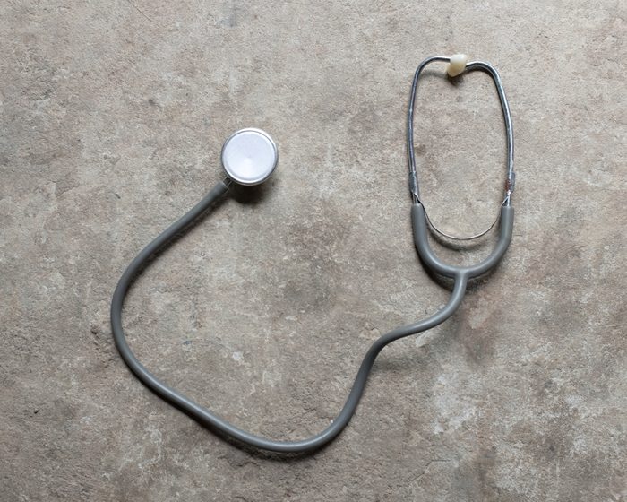 Stethoscope on gray background