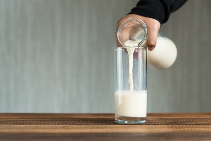 pouring milk into glass