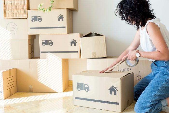 woman packing up boxes for moving