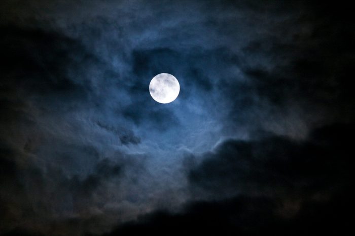 full moon breaking through the clouds