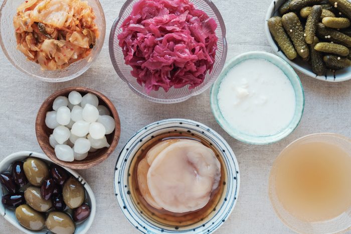 Variety of fermented probiotic foods for gut health.