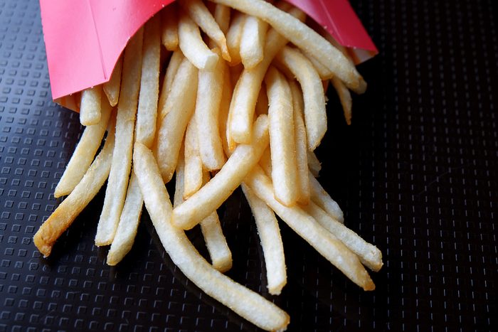 Bangkok, Thailand - 17,July 2018 : A closed up photo of junk food with selective focus on Fresh fried french fries from McDonalds .Editorial only, McDonald's is a brand from America.