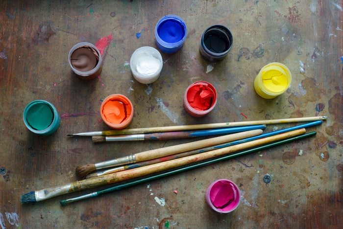 Set of brushes and paints on the table