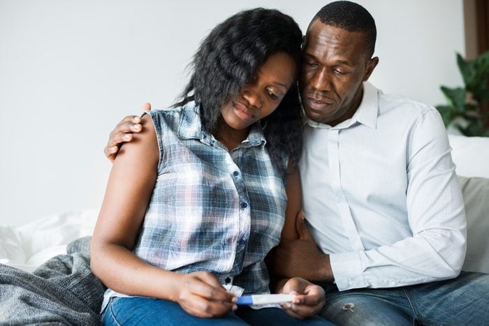 Black couple with a negative pregnancy test result