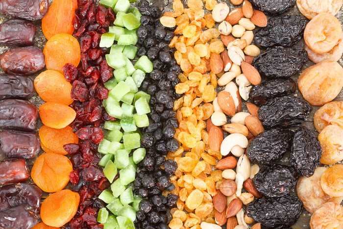 rows of different dried fruit: figs, apricots, cranberries, raisins