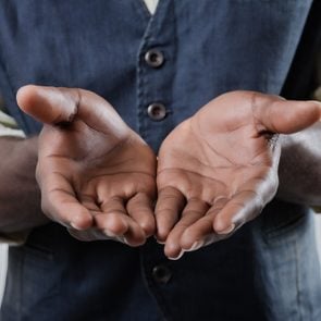 African-American holds open palm