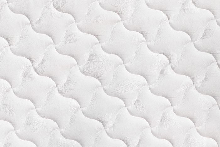 Background of soft comfortable quilted white mattress