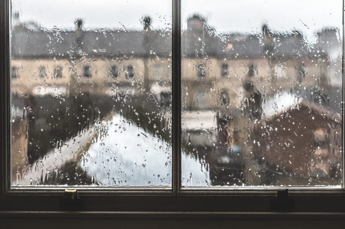 Gloomy rainy window with a view on provincial english town