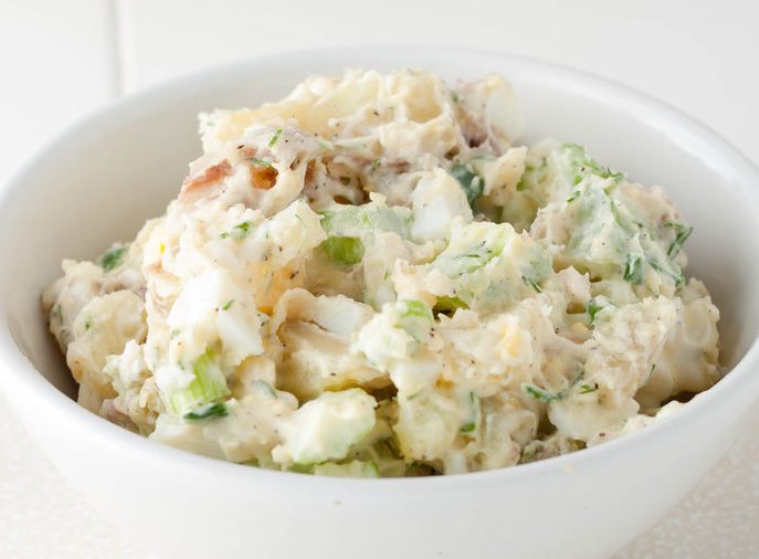 Homemade potato salad with red potatoes and celery.